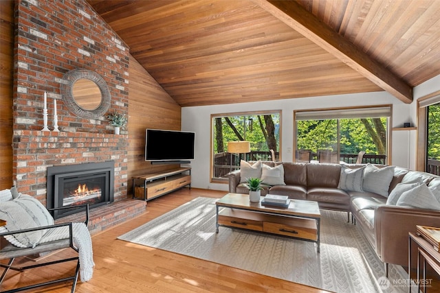 3216 142nd Pl NE, Bellevue, WA 98007 - living area with wooden ceiling, healthy amount of natural light, a brick fireplace, wood finished floors, and wooden walls