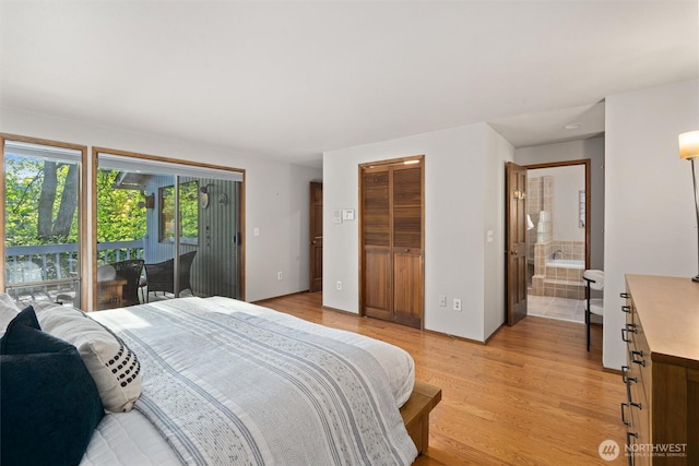 3216 142nd Pl NE, Bellevue, WA 98007 - bedroom with light wood-style floors, access to exterior, and ensuite bath