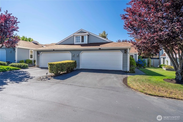 6020 N Highlands Pkwy Unit 52B, Tacoma, WA 98406 - view of front of property with driveway, a front lawn, an attached garage, and roof with shingles