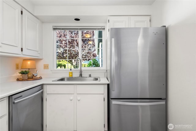 6020 N Highlands Pkwy Unit 52B, Tacoma, WA 98406 - kitchen with appliances with stainless steel finishes, white cabinetry, and light countertops
