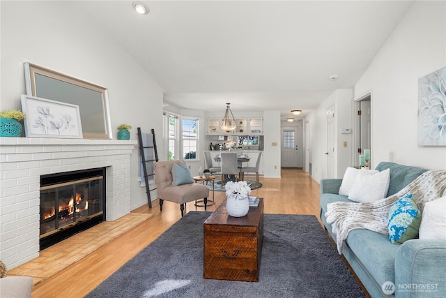 6020 N Highlands Pkwy Unit 52B, Tacoma, WA 98406 - living area featuring wood finished floors, a fireplace, and recessed lighting