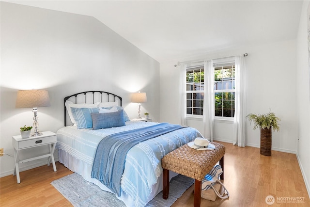 6020 N Highlands Pkwy Unit 52B, Tacoma, WA 98406 - bedroom with light wood-type flooring and vaulted ceiling