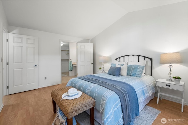 6020 N Highlands Pkwy Unit 52B, Tacoma, WA 98406 - bedroom with lofted ceiling and wood finished floors