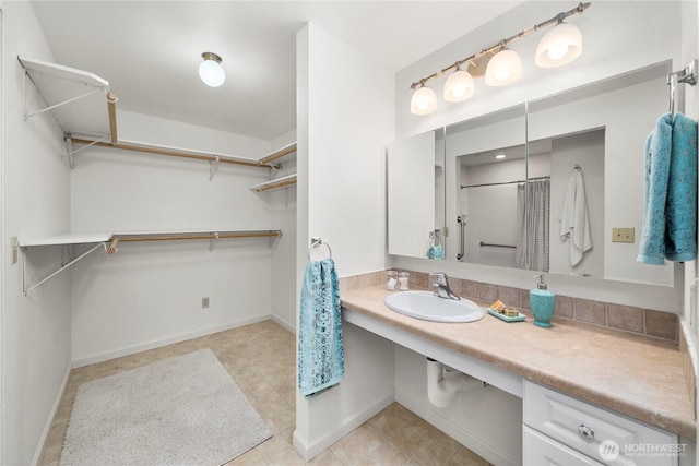 6020 N Highlands Pkwy Unit 52B, Tacoma, WA 98406 - full bathroom with a spacious closet, a shower with curtain, and tile patterned floors
