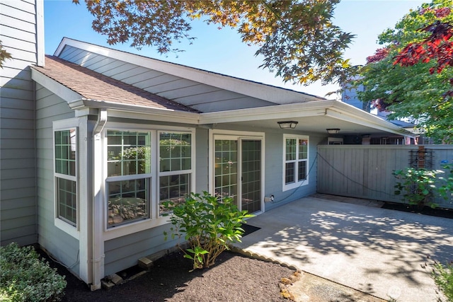 6020 N Highlands Pkwy Unit 52B, Tacoma, WA 98406 - rear view of property featuring a shingled roof and a patio area