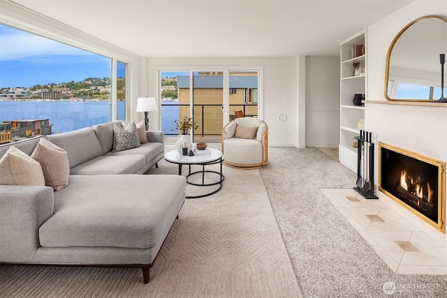 2301 Fairview Ave E Unit 404, Seattle, WA 98102 - living room with carpet, a fireplace with flush hearth, and a water view
