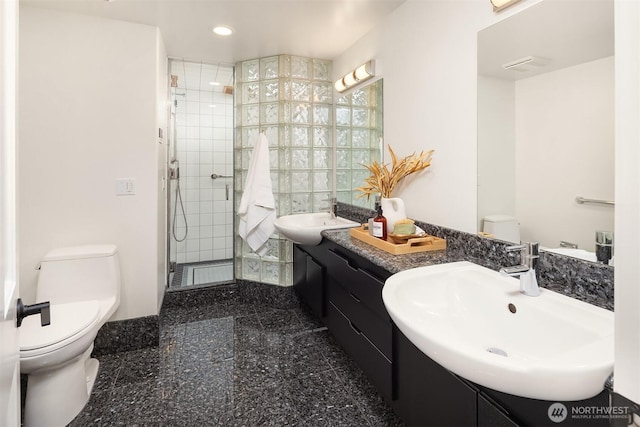 2301 Fairview Ave E Unit 404, Seattle, WA 98102 - full bath featuring recessed lighting, a stall shower, granite tiled floors, and double vanity