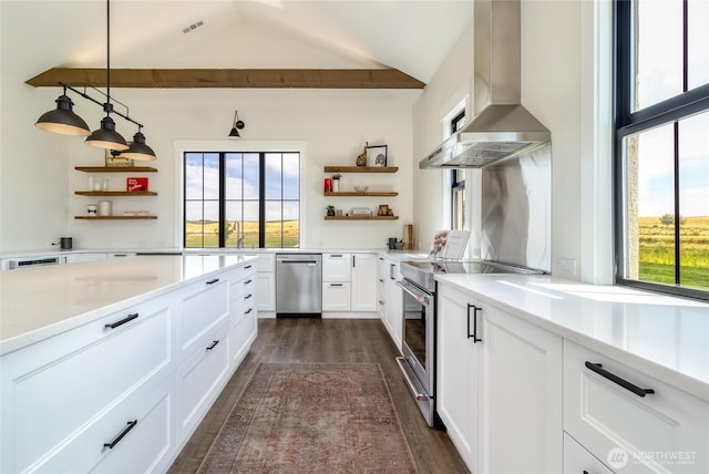 2617 Byrnes Rd, Touchet, WA 99360 - kitchen featuring open shelves, stainless steel appliances, wall chimney range hood, dark wood-type flooring, and vaulted ceiling