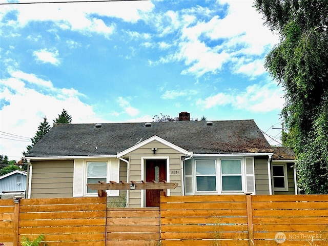 10204 19th Ave SW, Seattle, WA 98146 - bungalow-style house with a chimney and a fenced front yard