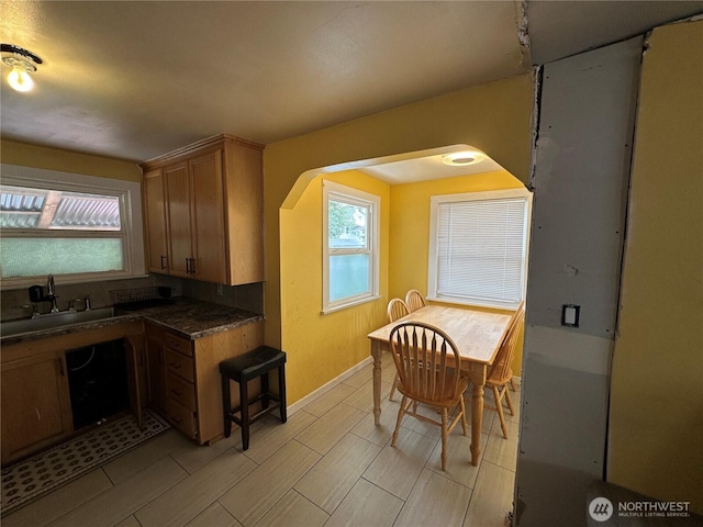 10204 19th Ave SW, Seattle, WA 98146 - kitchen featuring dark countertops and wood tiled floors