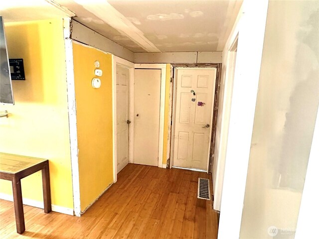 10204 19th Ave SW, Seattle, WA 98146 - corridor featuring wood finished floors
