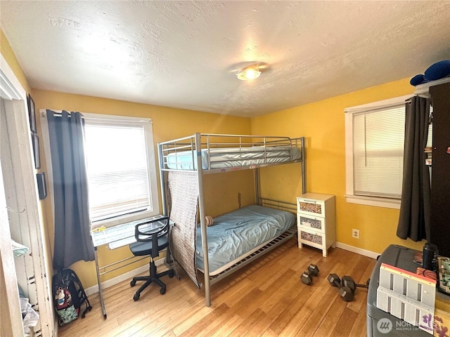 10204 19th Ave SW, Seattle, WA 98146 - bedroom featuring hardwood / wood-style floors and baseboards