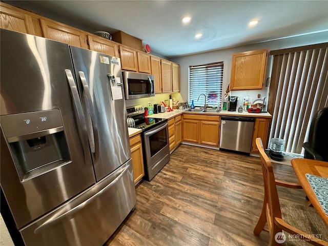 1700 Lincoln Park Cir, Wenatchee, WA 98801 - kitchen featuring appliances with stainless steel finishes, light countertops, dark wood-type flooring, and recessed lighting