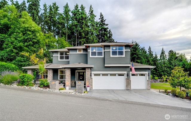 5708 197th Pl SE, Bothell, WA 98012 - prairie-style home featuring stone siding, driveway, a porch, a garage, and view of scattered trees