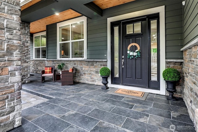 5708 197th Pl SE, Bothell, WA 98012 - view of exterior entry with stone siding and covered porch