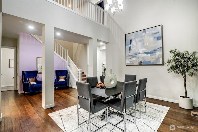 5708 197th Pl SE, Bothell, WA 98012 - dining space with wood-type flooring, a towering ceiling, stairway, and a chandelier