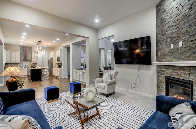 5708 197th Pl SE, Bothell, WA 98012 - living area featuring a stone fireplace, recessed lighting, and stairs