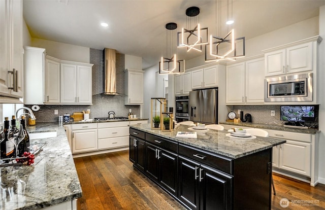 5708 197th Pl SE, Bothell, WA 98012 - kitchen with wall chimney exhaust hood, stainless steel appliances, white cabinets, dark cabinetry, and recessed lighting