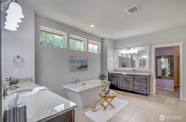 5708 197th Pl SE, Bothell, WA 98012 - full bathroom with two vanities, a freestanding bath, and tile patterned floors