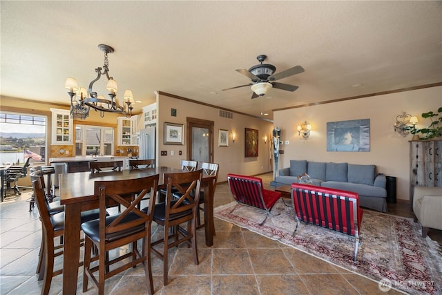 2020 W Woodin Ave, Chelan, WA 98816 - dining area featuring a chandelier, crown molding, a ceiling fan, and a textured ceiling