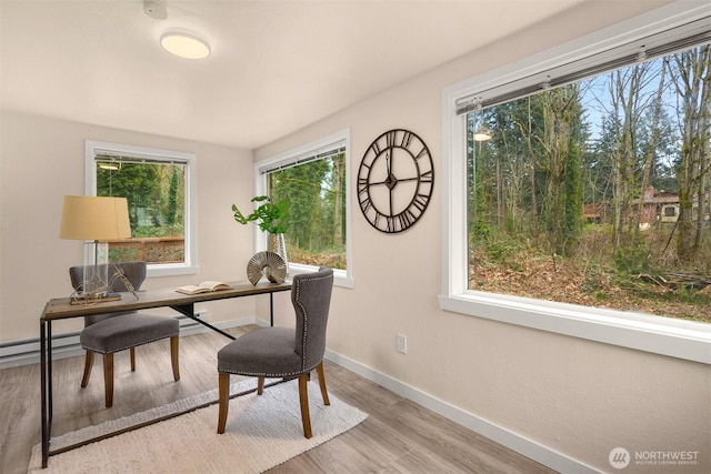 18006 116th Ave SE, Renton, WA 98058 - office area featuring wood finished floors and a baseboard heating unit