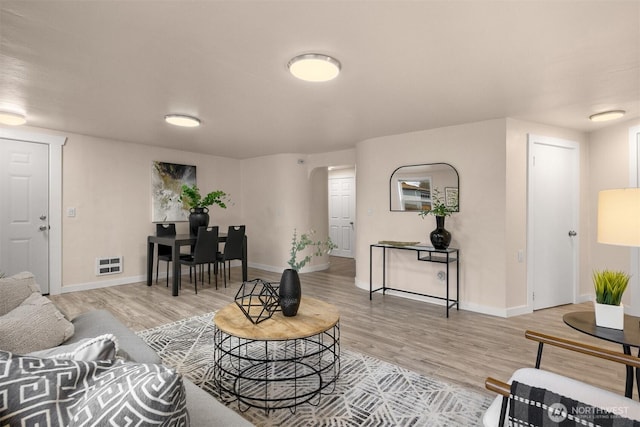 18006 116th Ave SE, Renton, WA 98058 - living room featuring wood finished floors and arched walkways