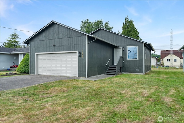 1608 W Market St, Aberdeen, WA 98520 - view of front of home featuring an attached garage, asphalt driveway, and a front yard