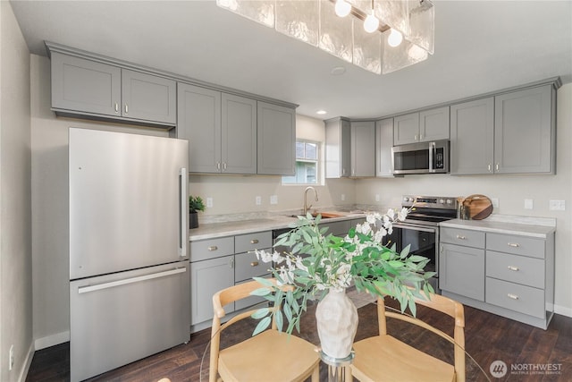 1608 W Market St, Aberdeen, WA 98520 - kitchen with stainless steel appliances, gray cabinets, dark wood-type flooring, light countertops, and recessed lighting