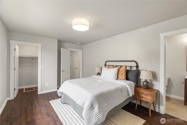 1608 W Market St, Aberdeen, WA 98520 - bedroom with wood finished floors and a walk in closet