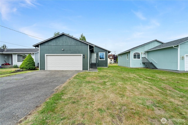1608 W Market St, Aberdeen, WA 98520 - view of front of property with a front lawn, entry steps, asphalt driveway, and an attached garage