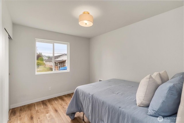 1604 W Market St, Aberdeen, WA 98520 - bedroom with light wood-style flooring and baseboards