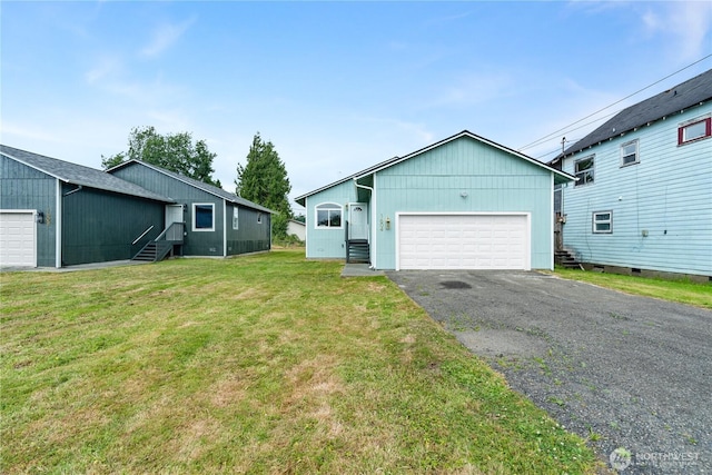1604 W Market St, Aberdeen, WA 98520 - view of front of home featuring a garage, a front lawn, and entry steps