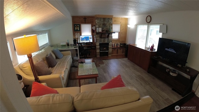 1200 Lincoln St Unit 148, Bellingham, WA 98229 - living area featuring wood finished floors, lofted ceiling, and a fireplace