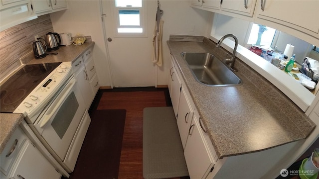 1200 Lincoln St Unit 148, Bellingham, WA 98229 - kitchen featuring electric stove, dark wood-style flooring, and white cabinets