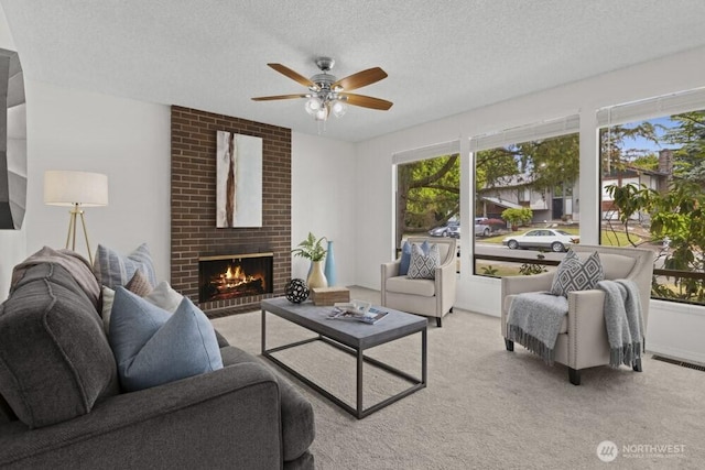 31609 41st Ave SW, Federal Way, WA 98023 - living area with a ceiling fan, healthy amount of natural light, a textured ceiling, a fireplace, and light carpet