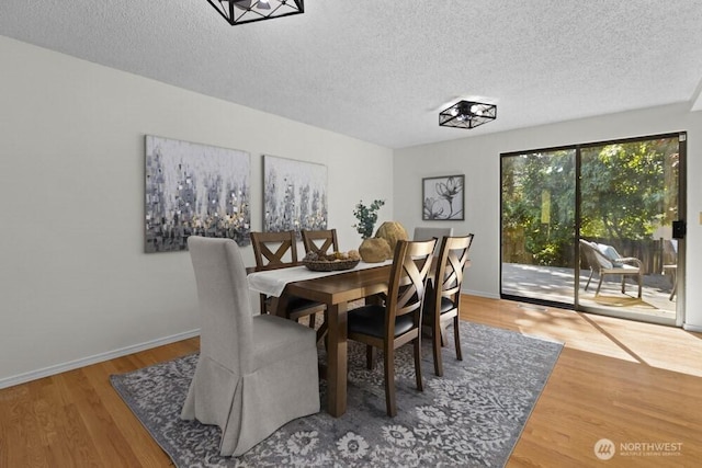 31609 41st Ave SW, Federal Way, WA 98023 - dining area with a textured ceiling and wood finished floors