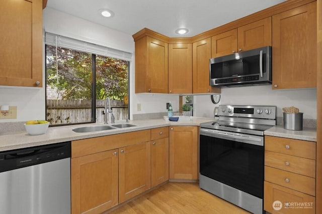 31609 41st Ave SW, Federal Way, WA 98023 - kitchen featuring appliances with stainless steel finishes, light countertops, light wood finished floors, and recessed lighting