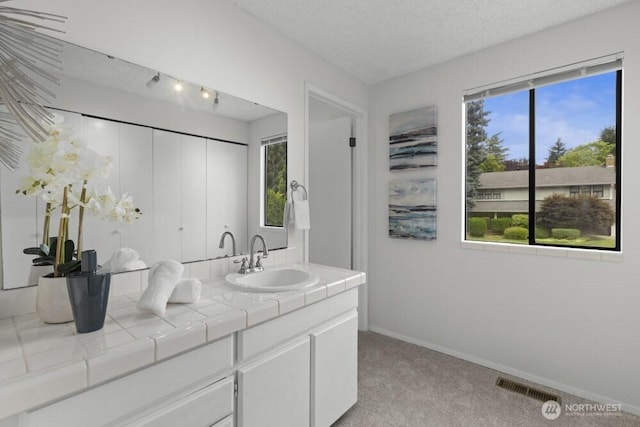 31609 41st Ave SW, Federal Way, WA 98023 - bathroom with double vanity and a textured ceiling