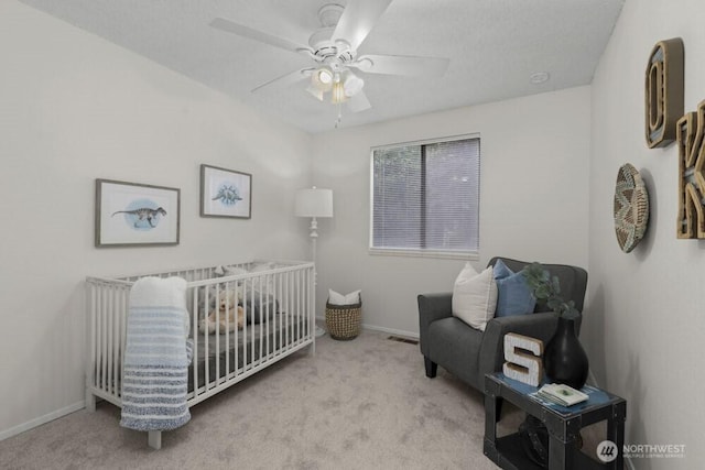 31609 41st Ave SW, Federal Way, WA 98023 - carpeted bedroom featuring a nursery area and ceiling fan