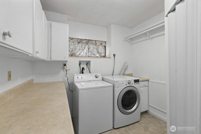 31609 41st Ave SW, Federal Way, WA 98023 - laundry area featuring washer and clothes dryer, cabinet space, and light tile patterned floors