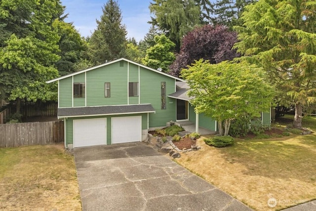 31609 41st Ave SW, Federal Way, WA 98023 - tri-level home featuring an attached garage and driveway
