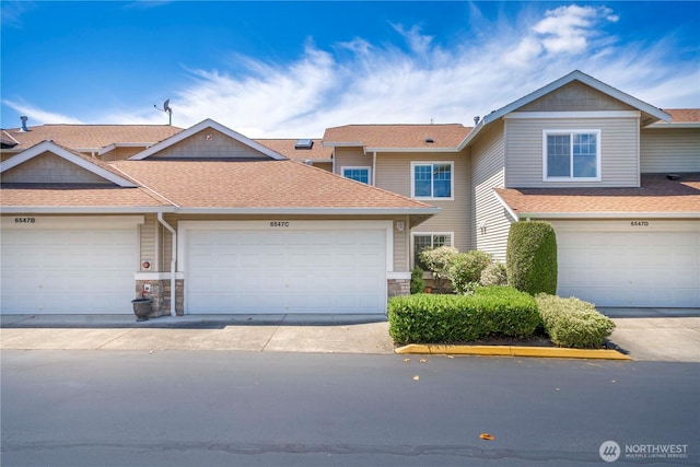 6547 Lindsay Ave SE Unit 18C, Auburn, WA 98092 - multi unit property featuring roof with shingles, stone siding, and a garage