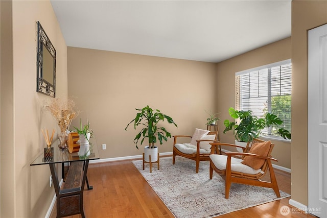 6547 Lindsay Ave SE Unit 18C, Auburn, WA 98092 - sitting room with wood finished floors and baseboards