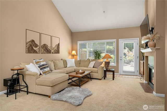 6547 Lindsay Ave SE Unit 18C, Auburn, WA 98092 - living area with carpet floors, a fireplace with flush hearth, and high vaulted ceiling