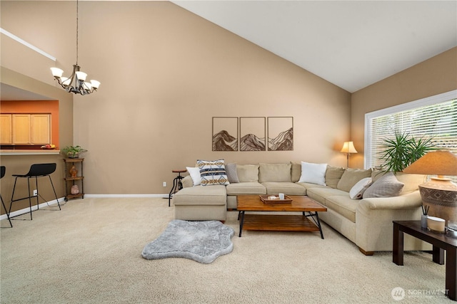 6547 Lindsay Ave SE Unit 18C, Auburn, WA 98092 - living room with high vaulted ceiling, light colored carpet, and a chandelier