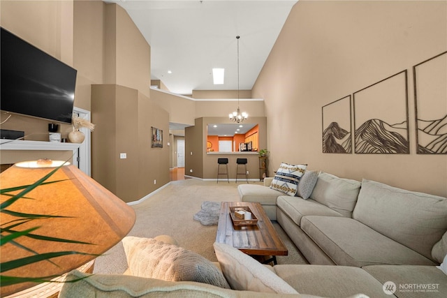 6547 Lindsay Ave SE Unit 18C, Auburn, WA 98092 - living room featuring carpet, a chandelier, and high vaulted ceiling