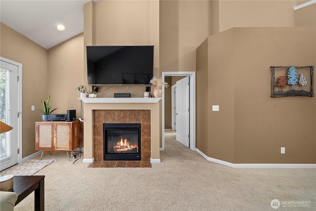 6547 Lindsay Ave SE Unit 18C, Auburn, WA 98092 - carpeted living room featuring a tile fireplace and high vaulted ceiling
