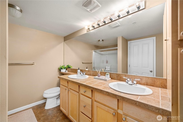 6547 Lindsay Ave SE Unit 18C, Auburn, WA 98092 - bathroom with double vanity, a stall shower, and tile patterned flooring