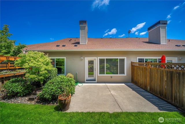 6547 Lindsay Ave SE Unit 18C, Auburn, WA 98092 - rear view of house with a chimney and a patio
