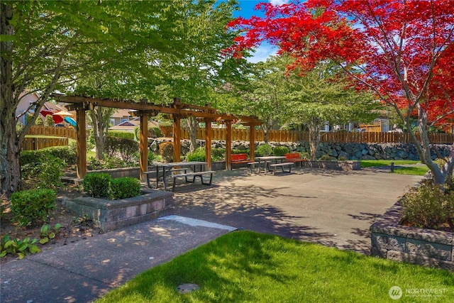 6547 Lindsay Ave SE Unit 18C, Auburn, WA 98092 - surrounding community featuring a pergola and a patio